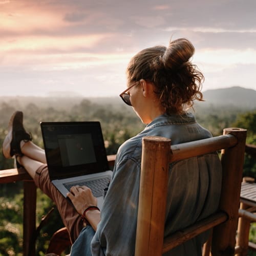 woman using laptop outside