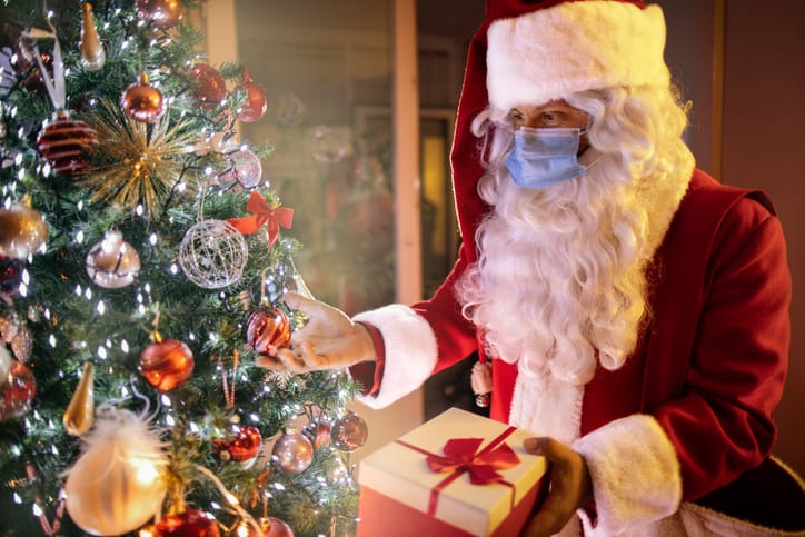 santa clause near christmas tree