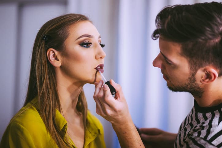 Professional MakeUp Artist applying makeup.