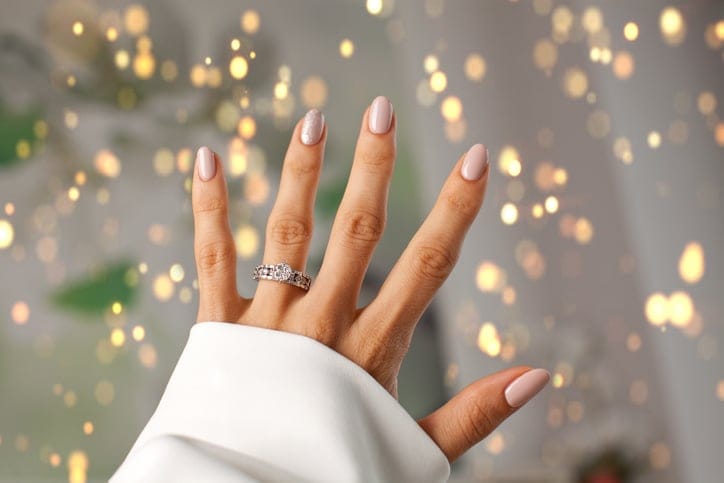 woman's hand with engagement ring
