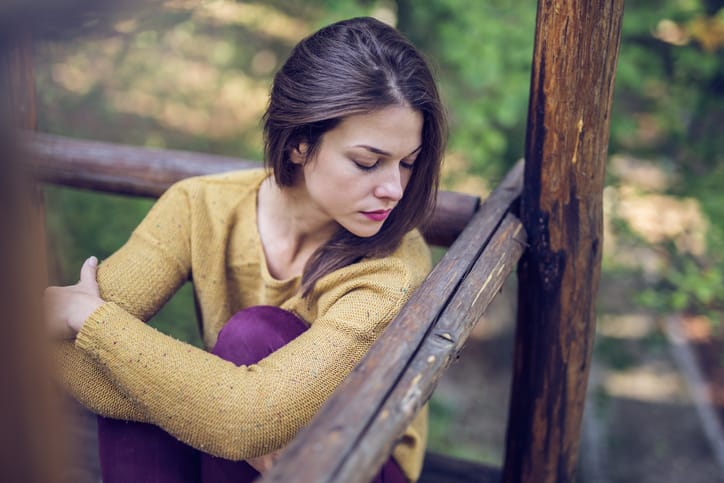 woman unhappy outside on terrace