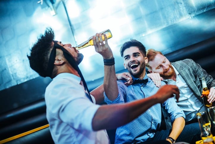 group of men drinking beers