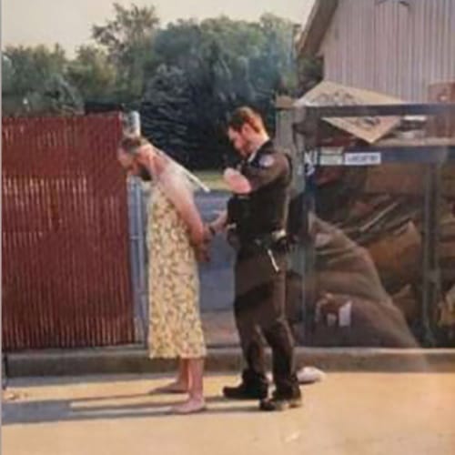 man arrested in yellow dress