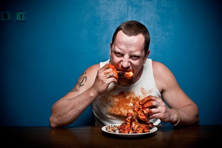 Man eating meat.