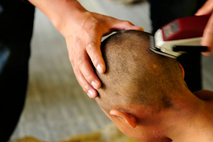man shaving head