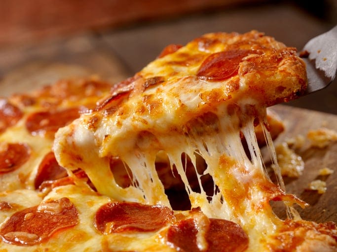 A cheesy pizza slice.