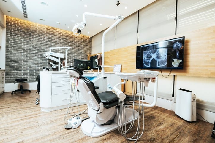 A dentist chair in the office.