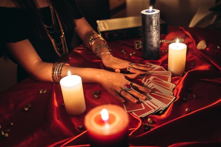 Fortune teller reading tarot cards.