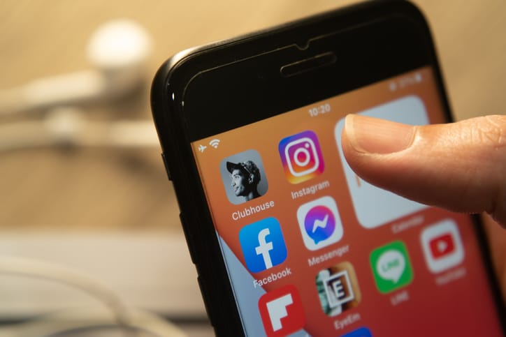 A smart phone in a hand.