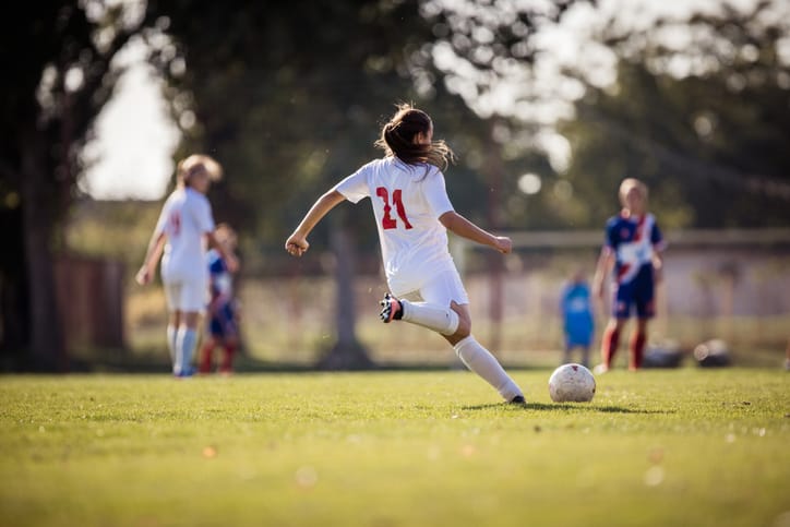 Young female soccer team.