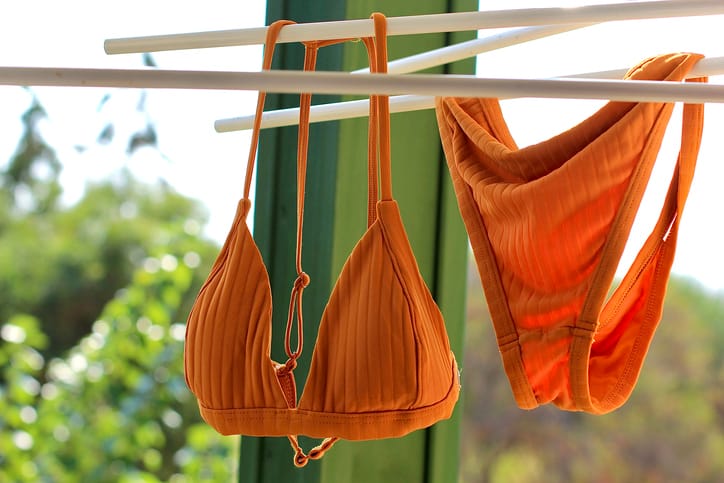 Orange bikini on a washing line.