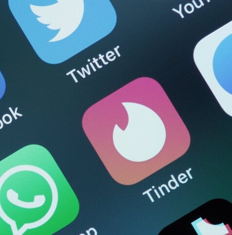 Tinder and Facebook applications on iPhone.