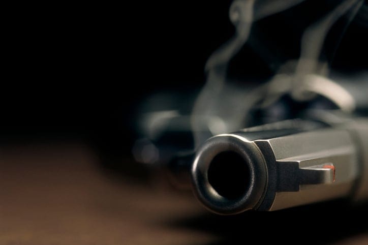 Smoking gun lying on the floor.