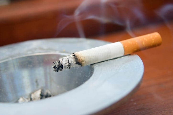 Cigarette in an ashtray.