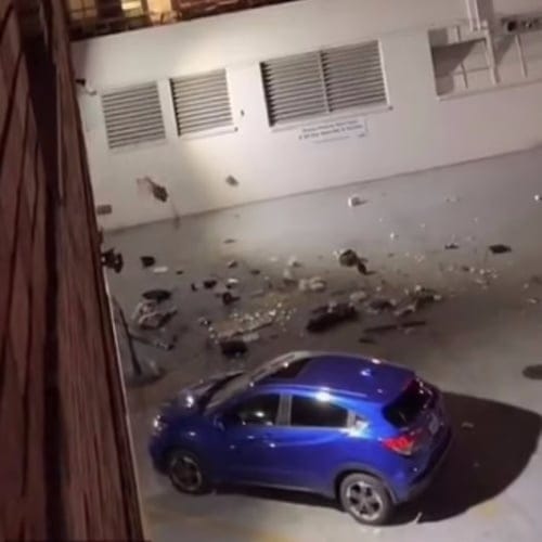 Scorned Woman Caught Throwing Cheating Boyfriend’s TV And Playstation 5 Out Third Story Window