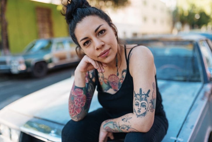 hispanic woman sitting car