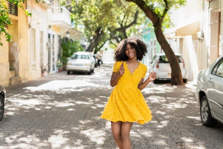 Young woman in a yellow dress.