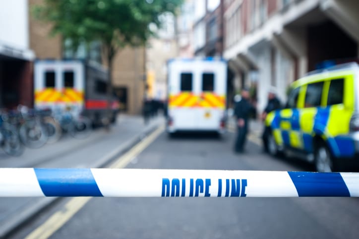 Police cordon off the street.