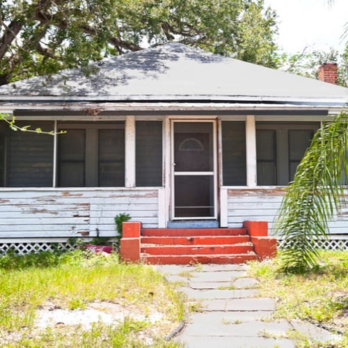 Front of a house with a porch.