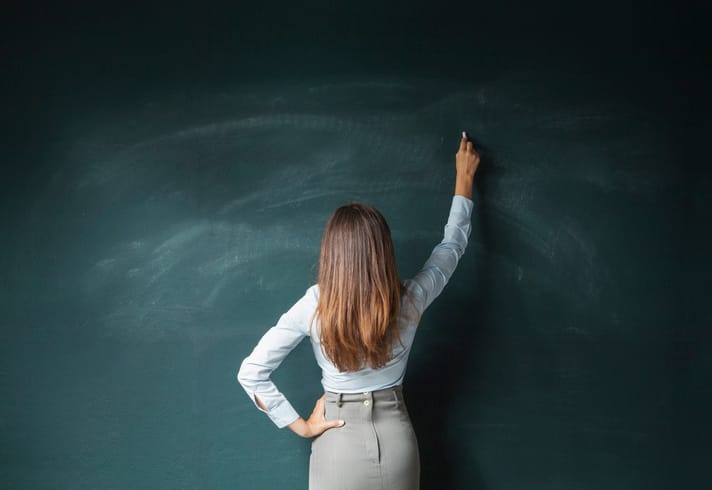 Teacher at the blackboard.