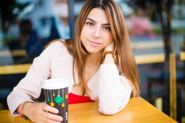 woman staring coffee