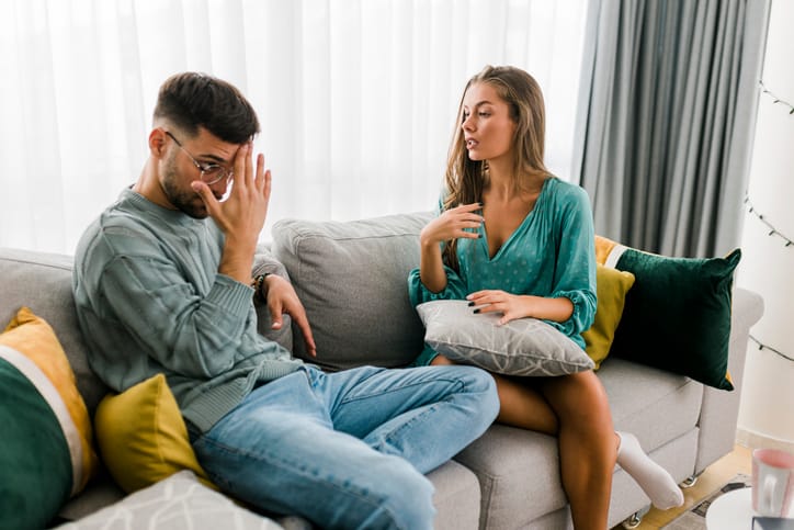 couple arguing on couch