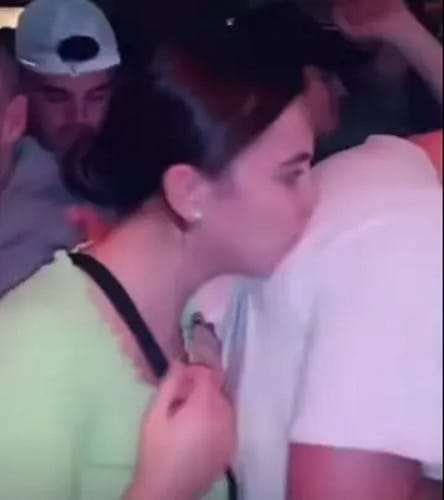 woman kissing man's shirt