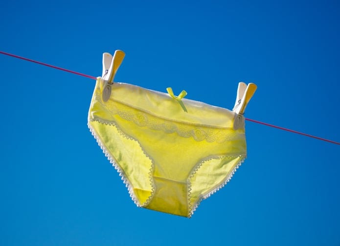 Yellow underwear on a washing line.