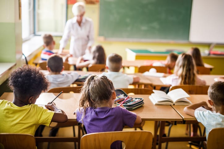 Elementary students attending a class.