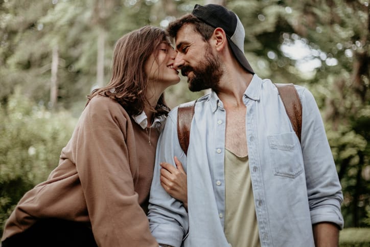 couple sharing intimate moment park