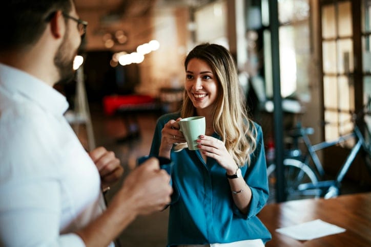 colleagues enjoying coffee in break room