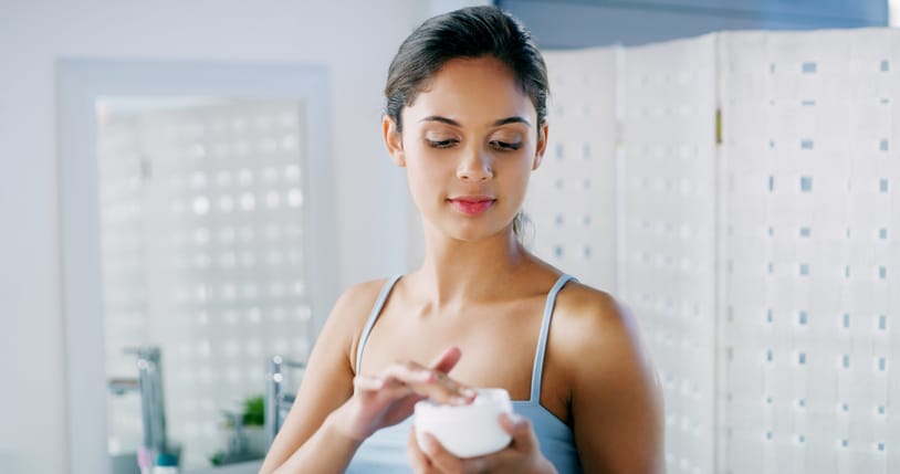 Woman using skincare.