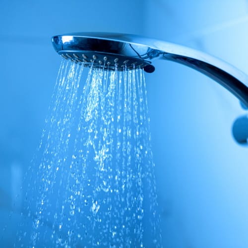 Shower head with running water.