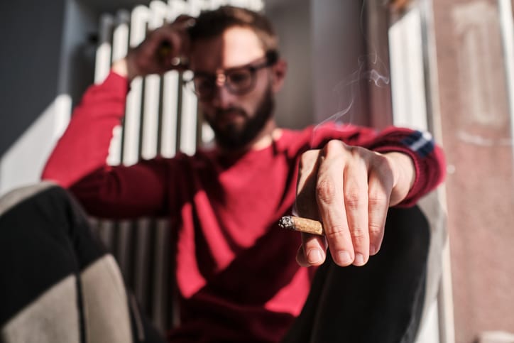 guy with cigar sad
