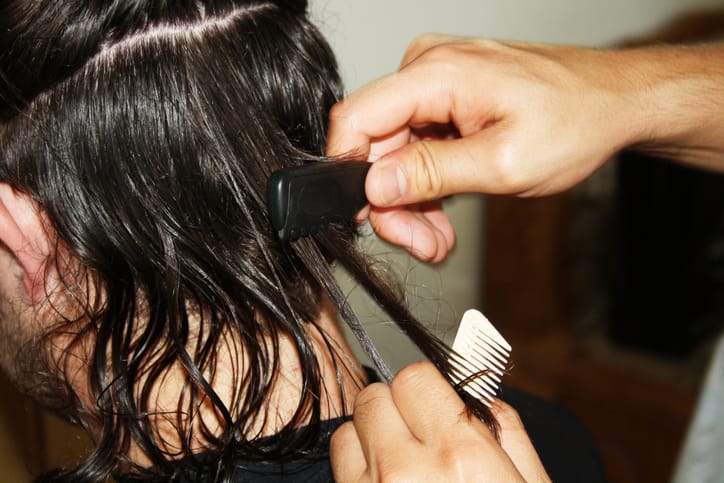 man getting his hair cut