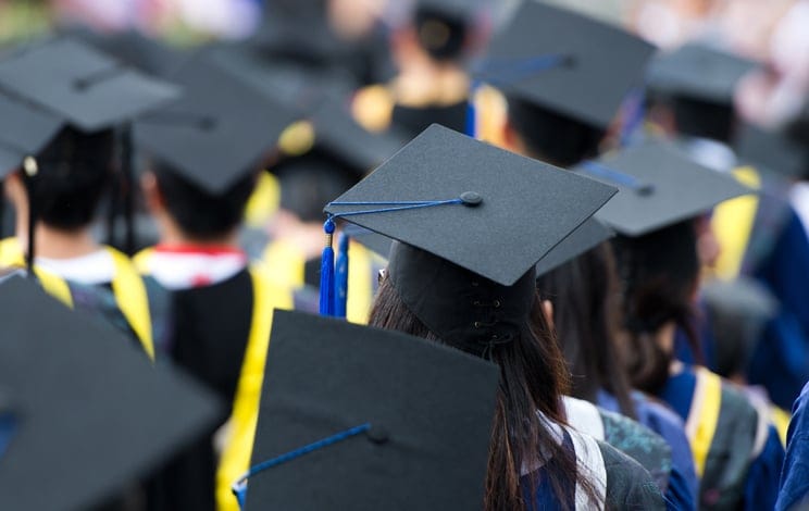 Shot of graduation caps during commencement.