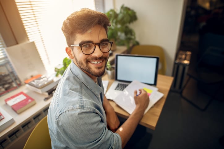 Man reading at his computer.