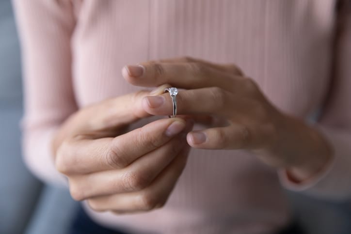 woman holding engagement ring