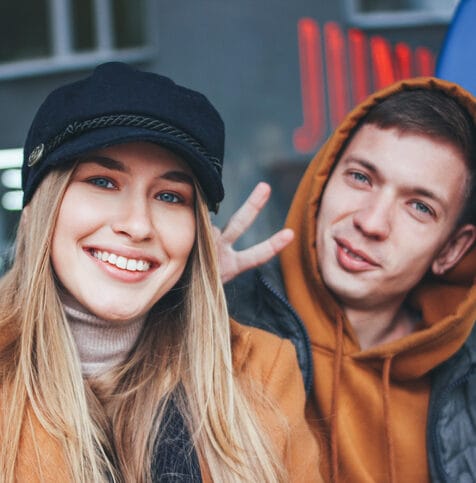 happy couple facing camera