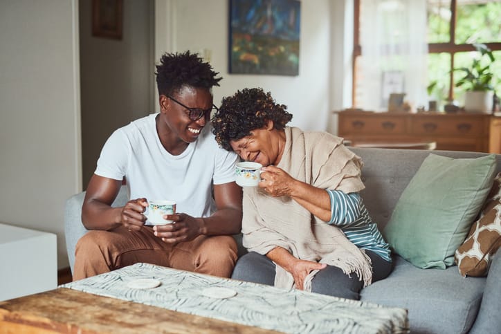 Man laughing with his mom.