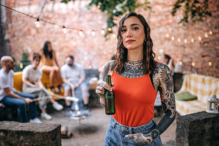 tattooed woman at party