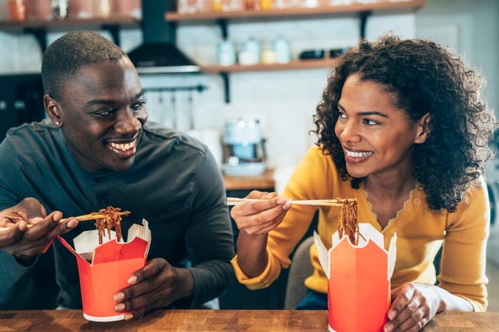 flirty couple enjoying chinese