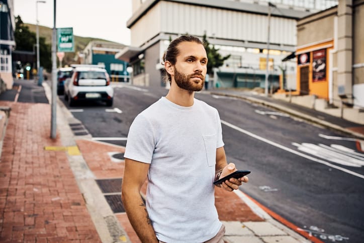 guy with phone outdoors