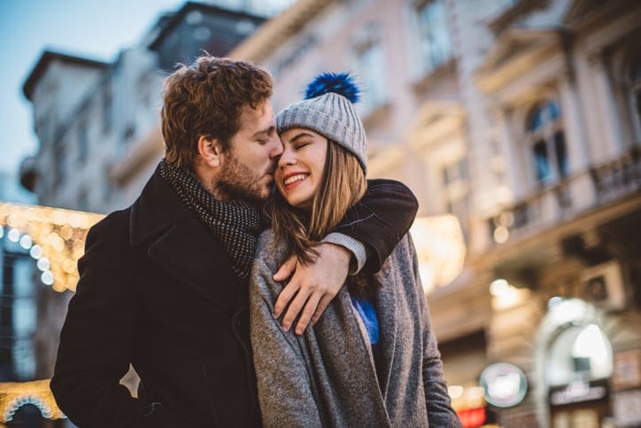 happy couple outside in winter