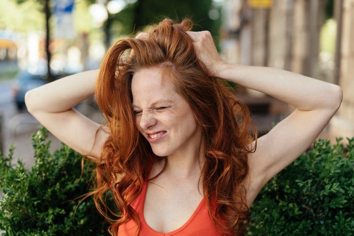 exasperated redheaded woman
