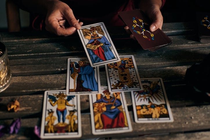 Woman doing tarot card reading.