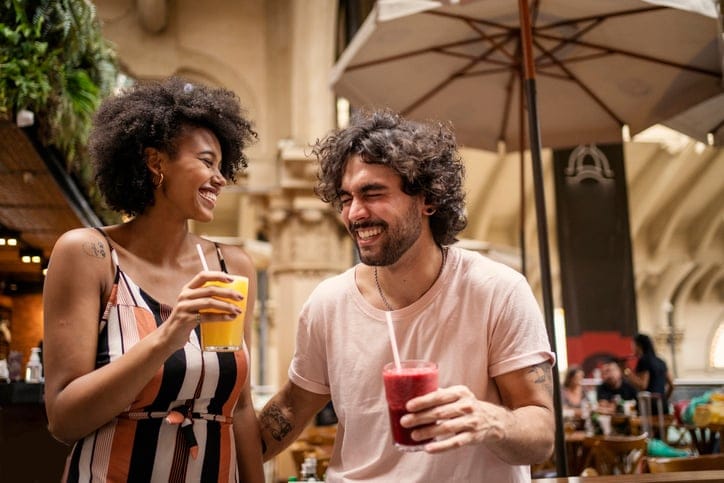 Tourists drinking juice in the municipal market of São Paulo.