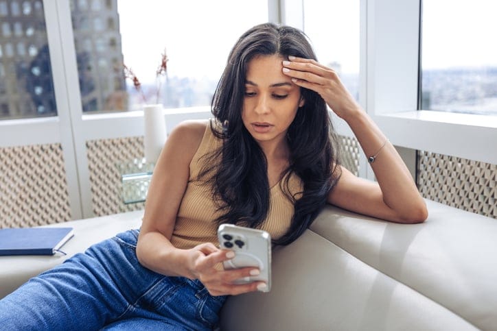 frustrated young woman texting
