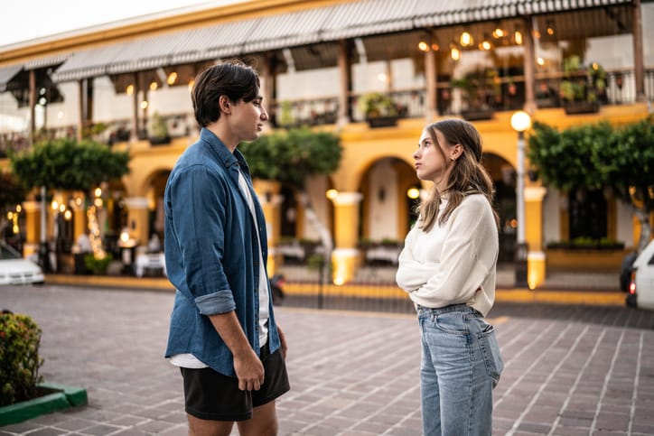 serious conversation outdoors couple
