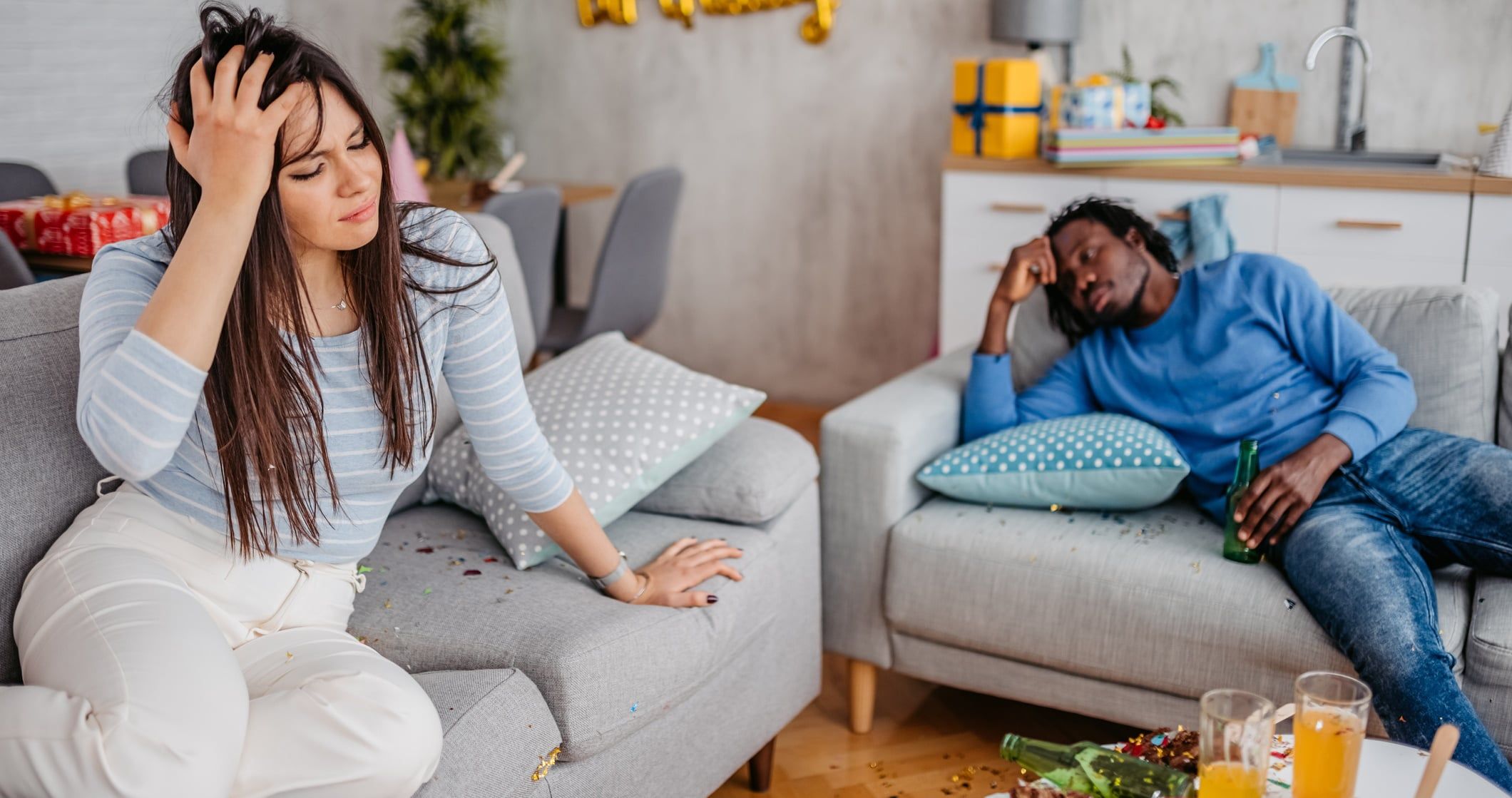 woman waking up with hangover after party